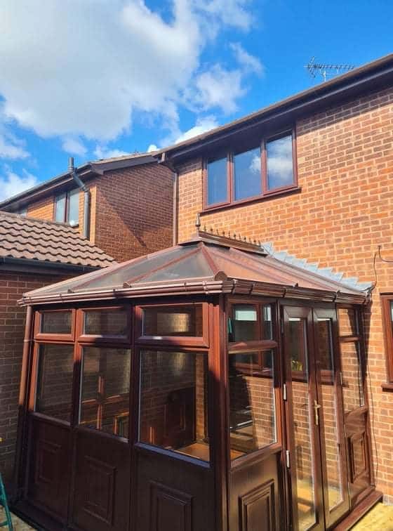 Brown tiled warm-roof conservatory by WeatherTech Roofing