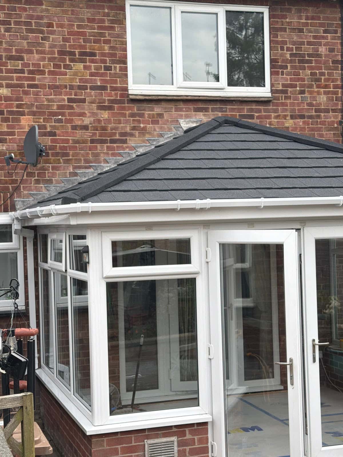 Grey tiled warm-roof conservatory by WeatherTech Roofing