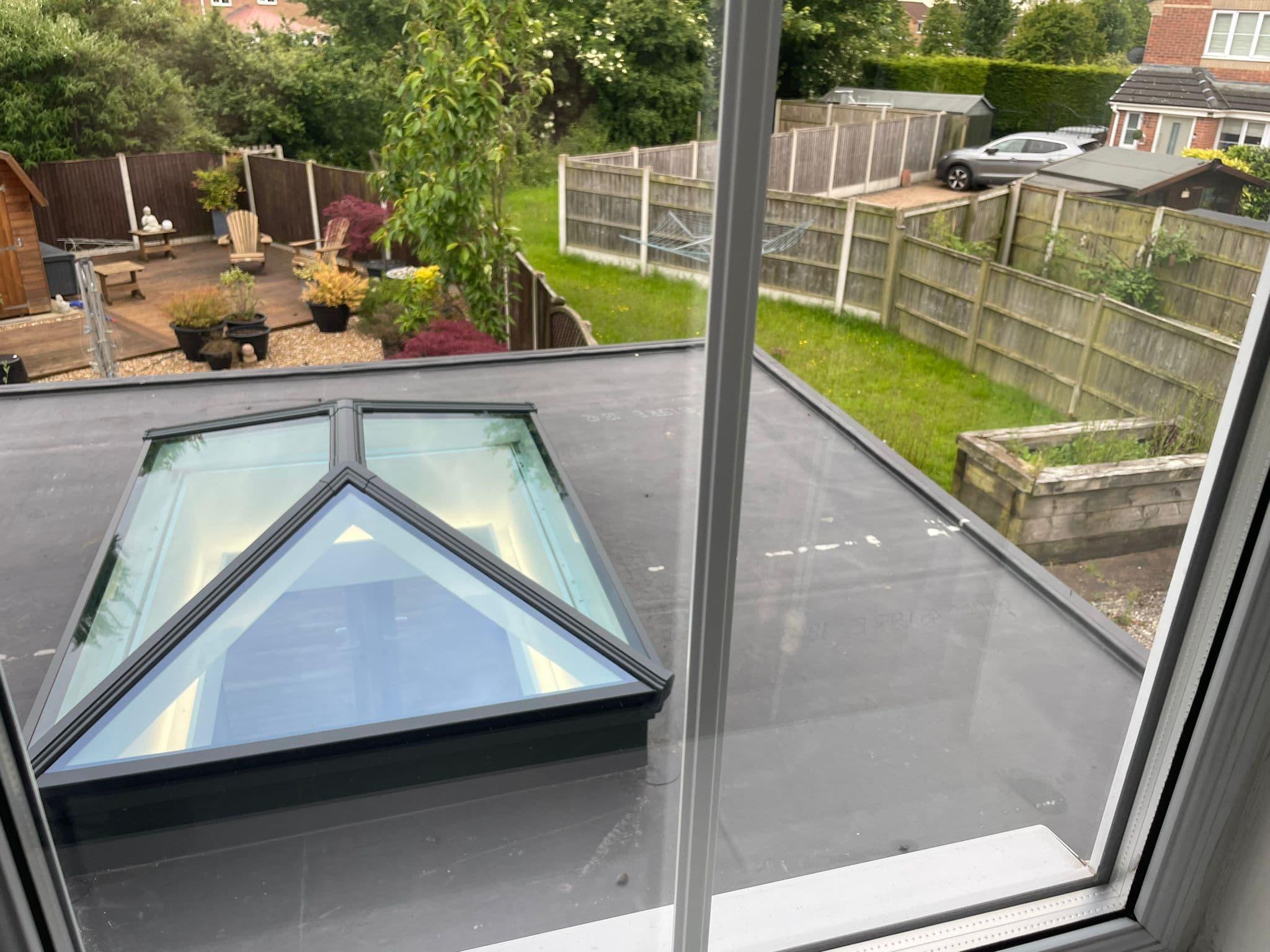 Glass lantern on the new flat warm roof, looking out over the garden