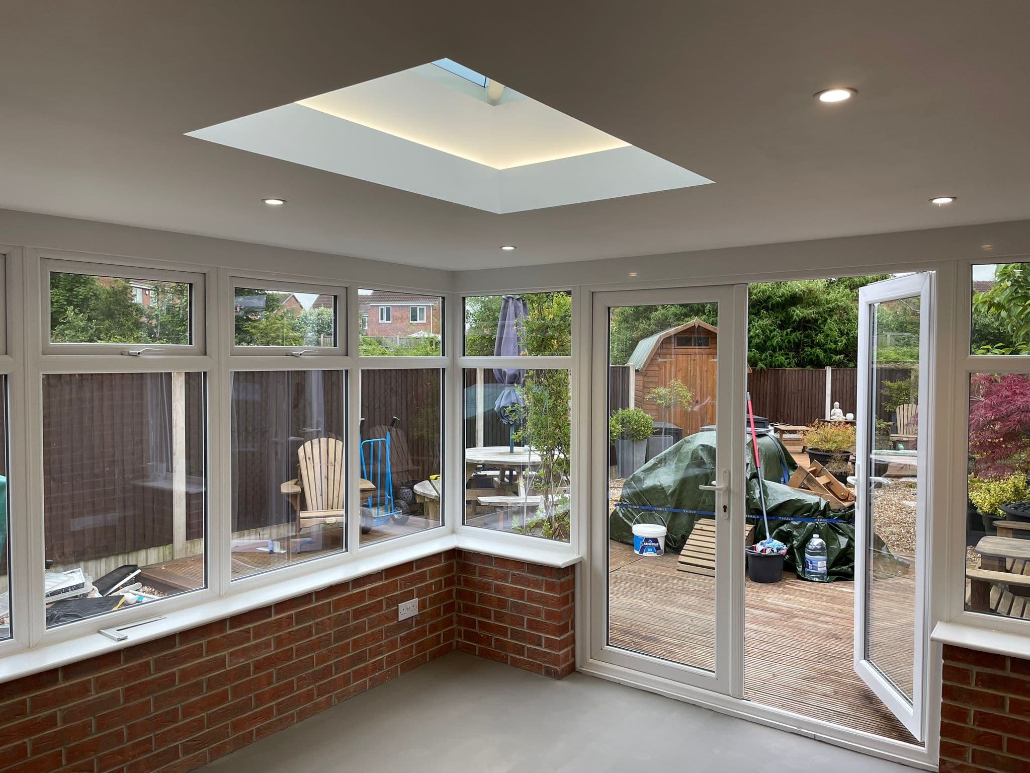 Interior view of the conservatory plastered ceiling and rooflight after the warm-roof conversion